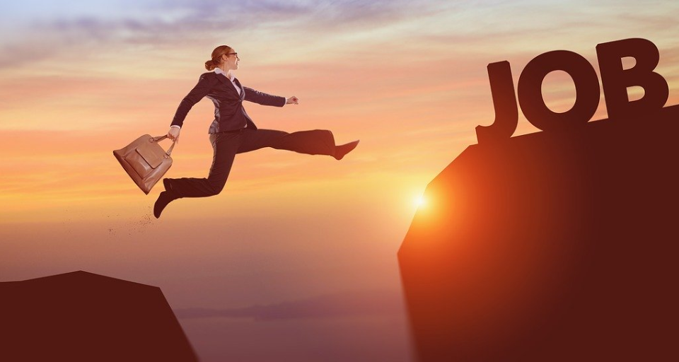 Image of lady jumping between mountains to job